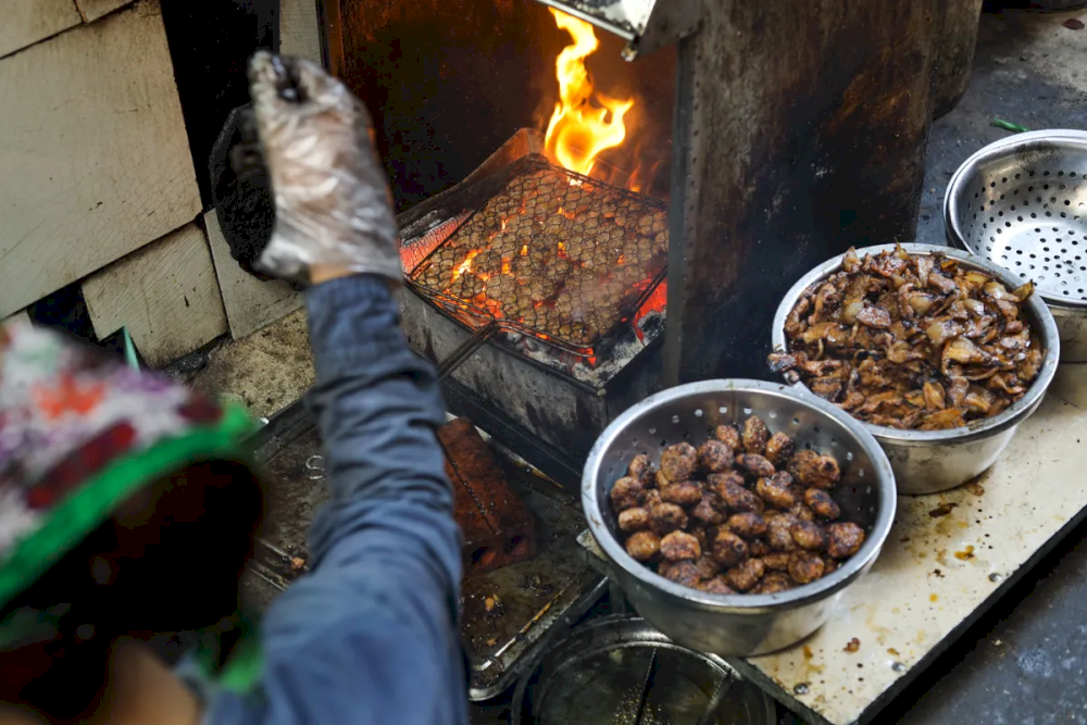 The pork is cooked over charcoal, ensuring a distinct smoky aroma